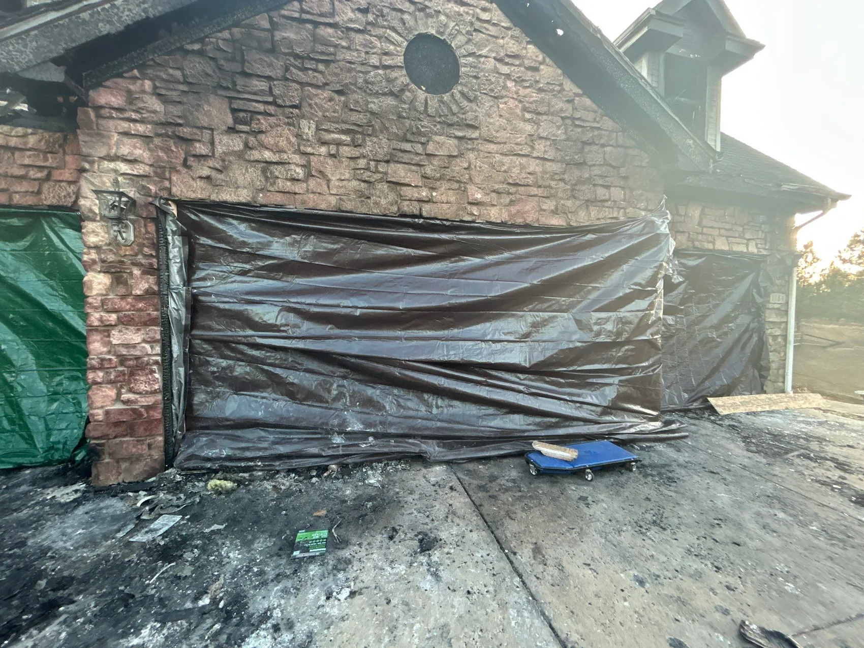 Emergency board-up securing a fire-damaged property