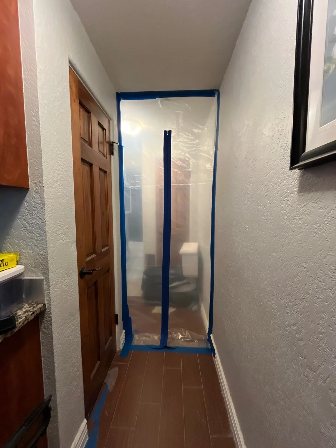 Containment sheeting sealing off a work area during mold remediation