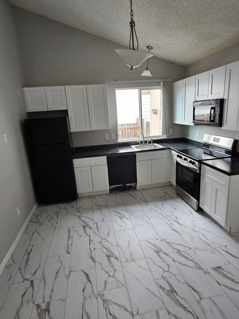 Restored white kitchen after reconstruction by Forefront