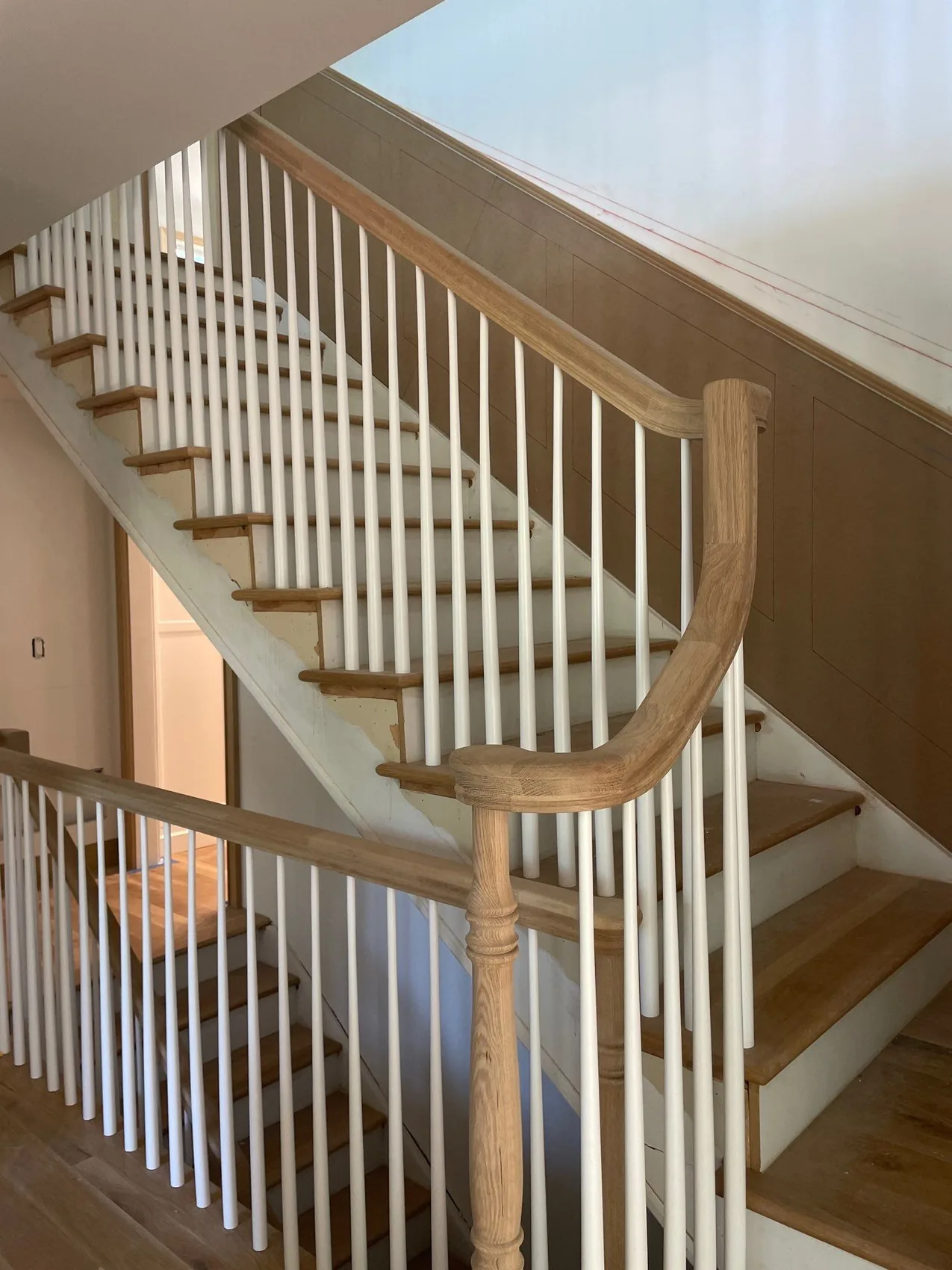 Finished staircase during the final walk-through of a reconstruction