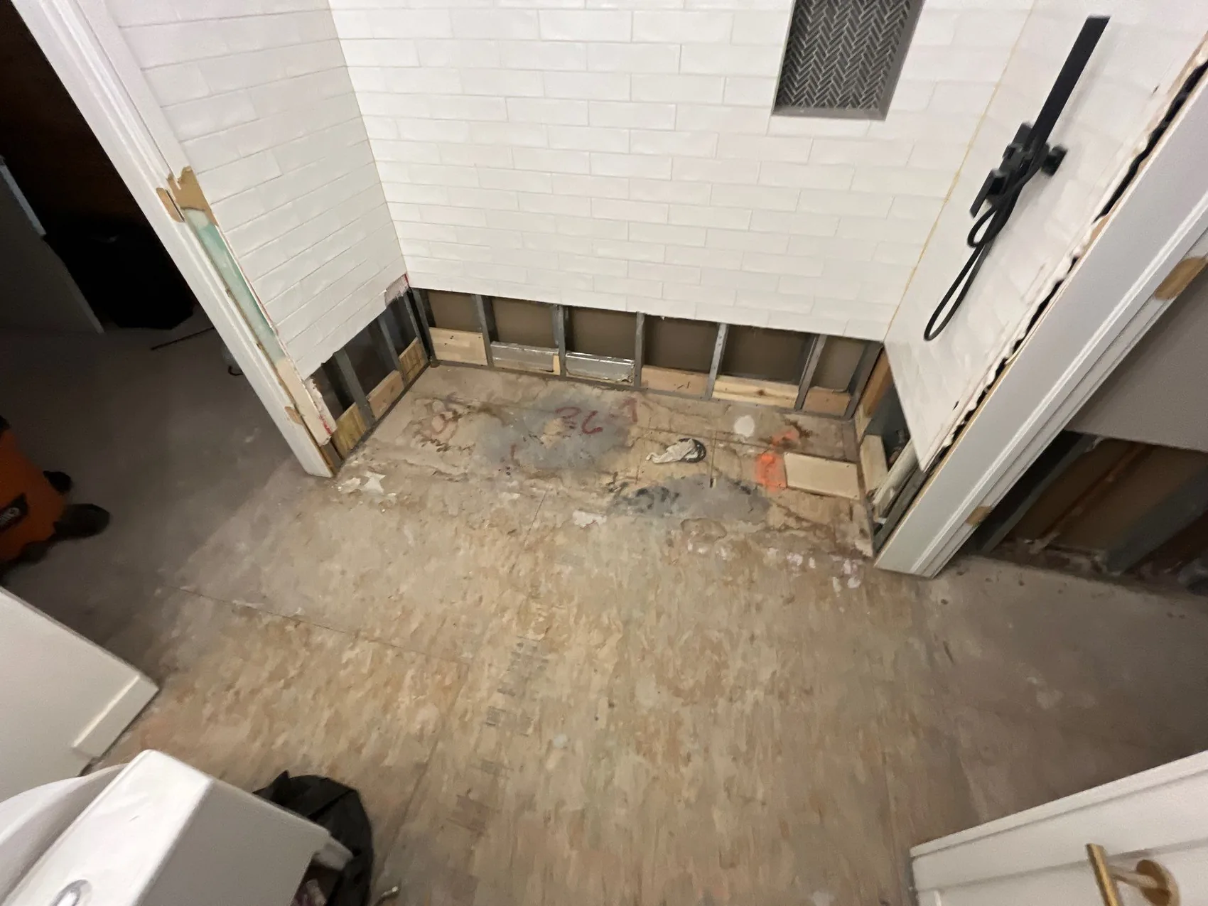 Home interior stripped to the structure after mitigation, before reconstruction