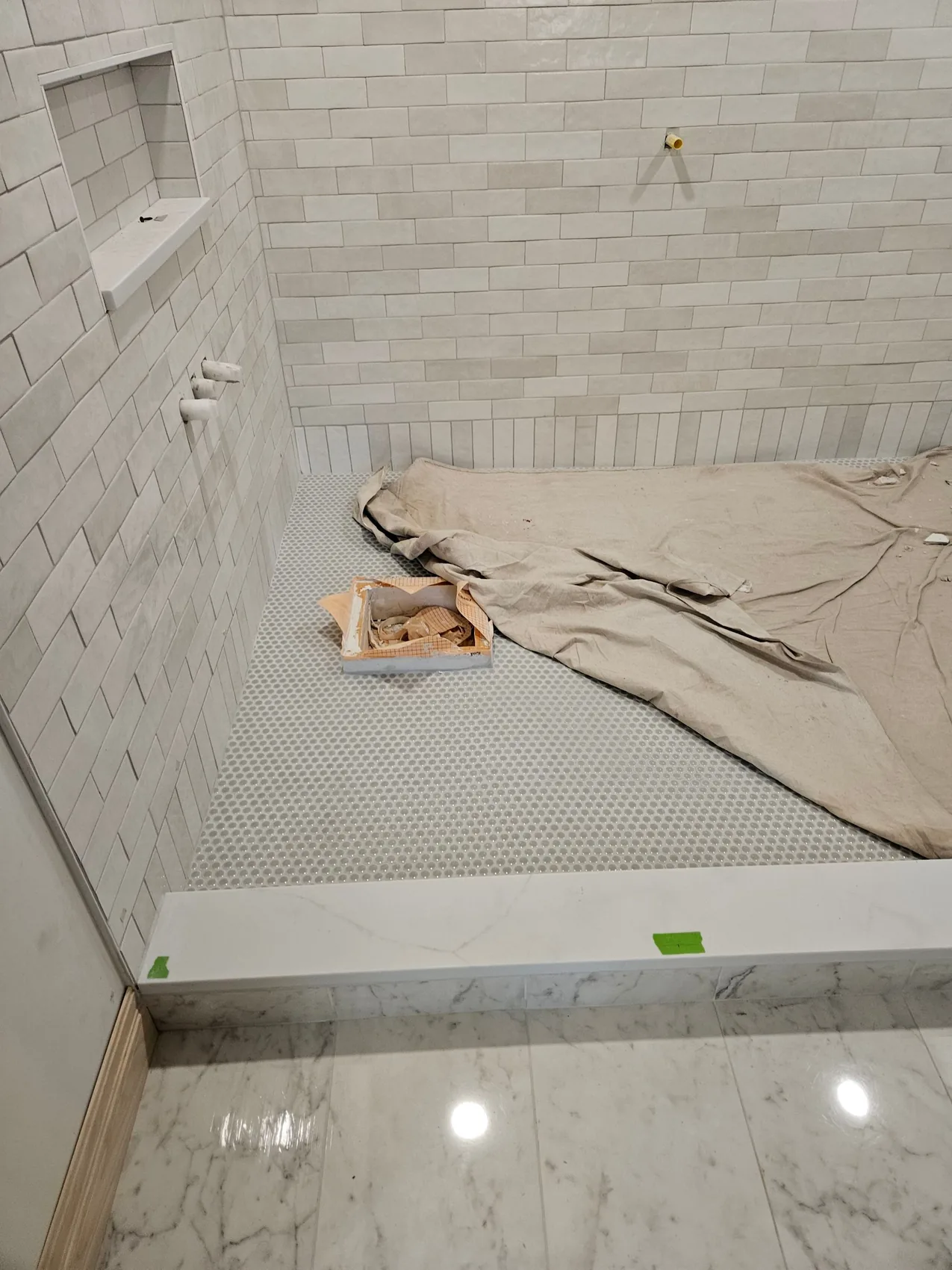 A finished bathroom restored after water damage repair