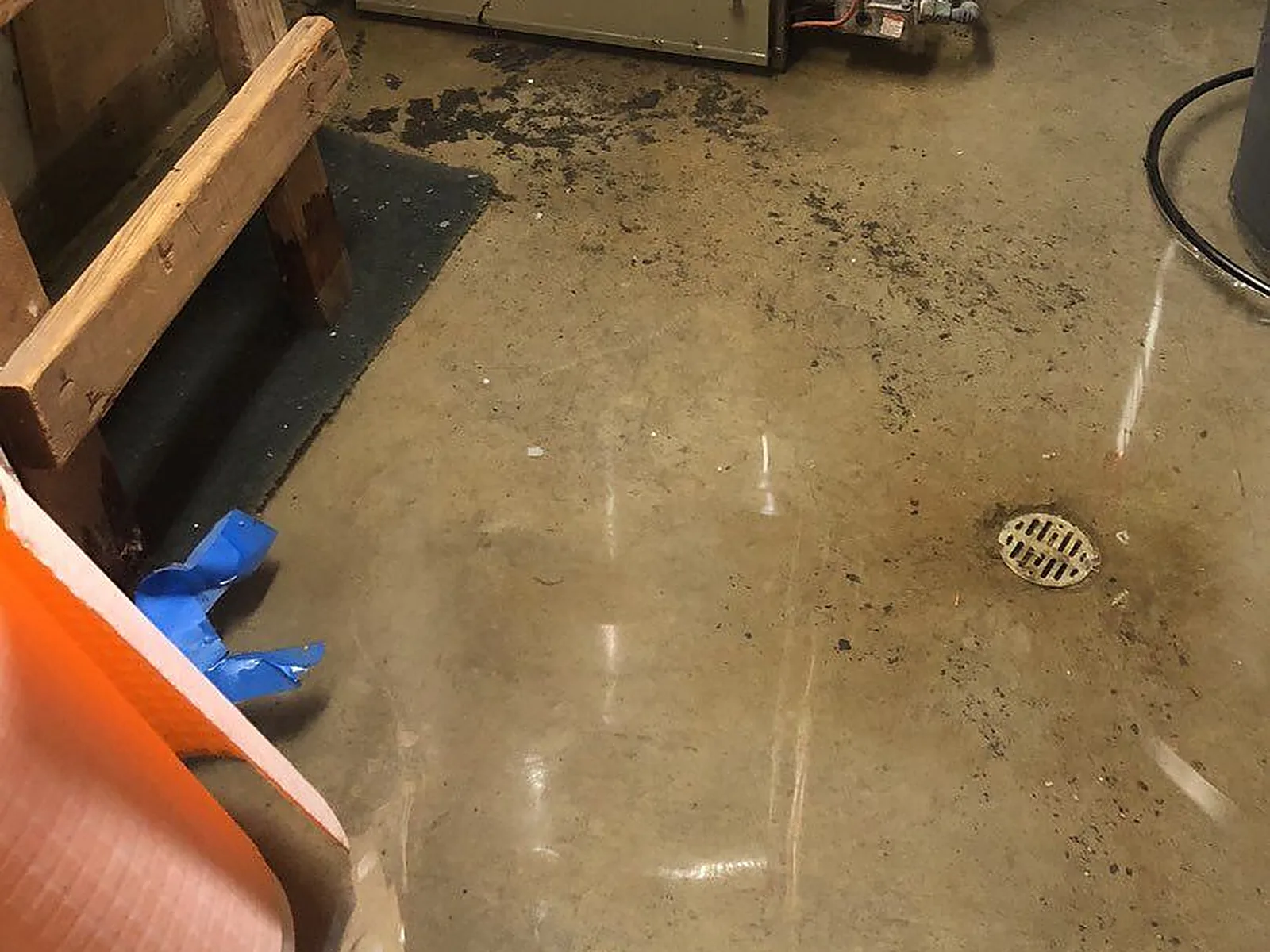 A basement utility-room floor drain where sewage can back up on the lowest level of a home