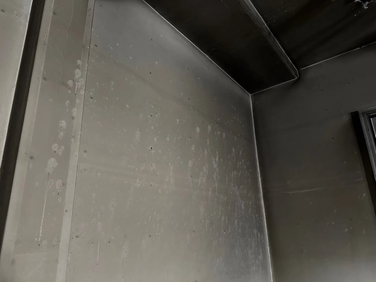 Soot blackening the ceiling and walls of a room, showing how far the smoke spread