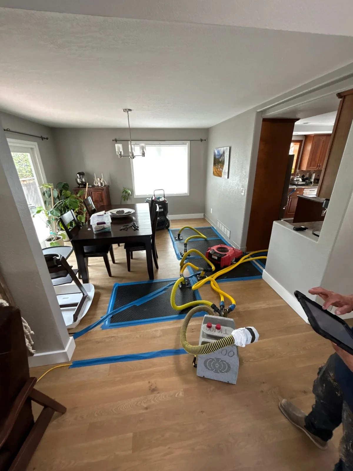 Air movers and dehumidifier structural drying a water-damaged Colorado living room
