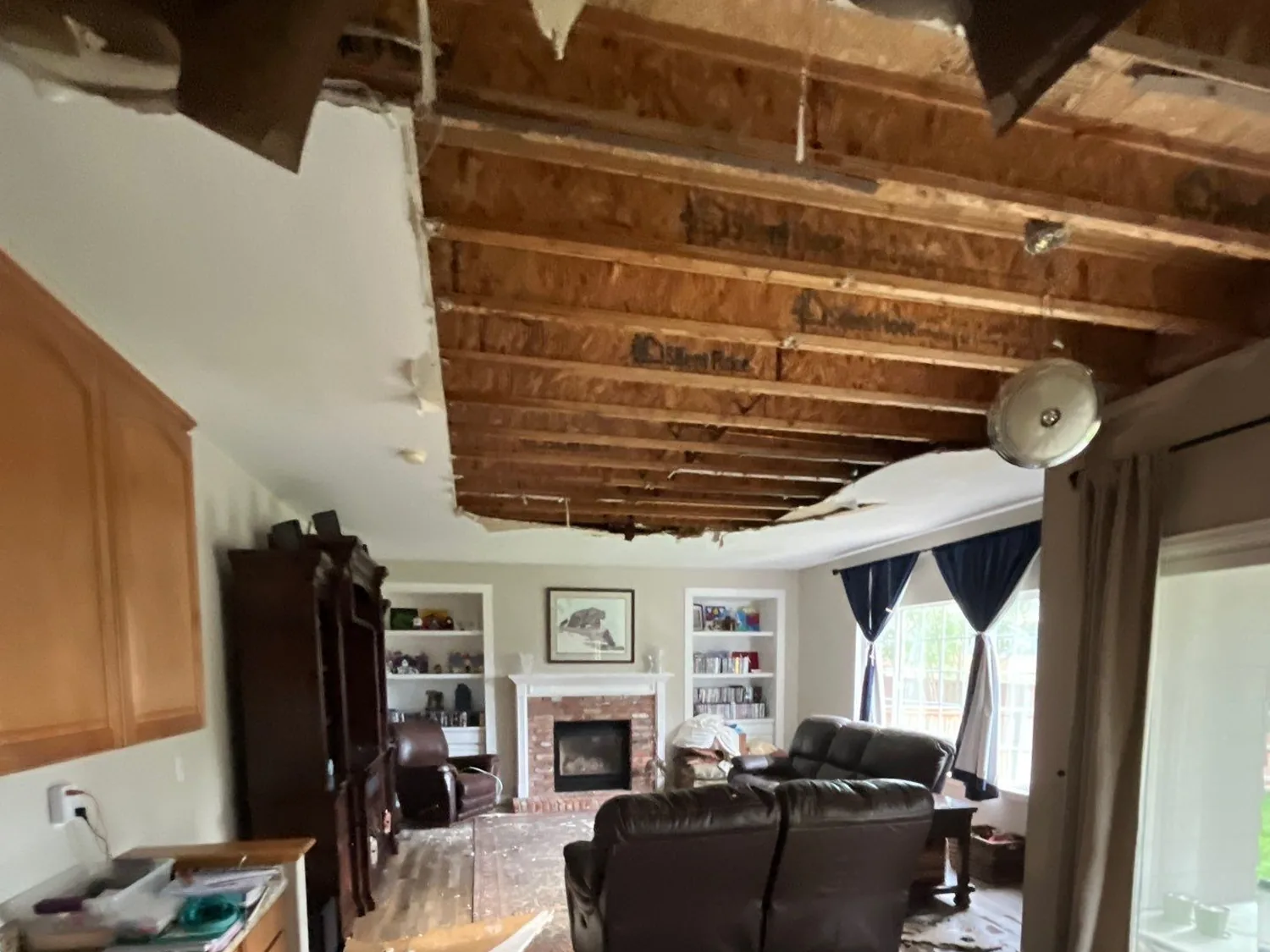 Collapsed ceiling and fallen drywall from a burst-pipe water loss