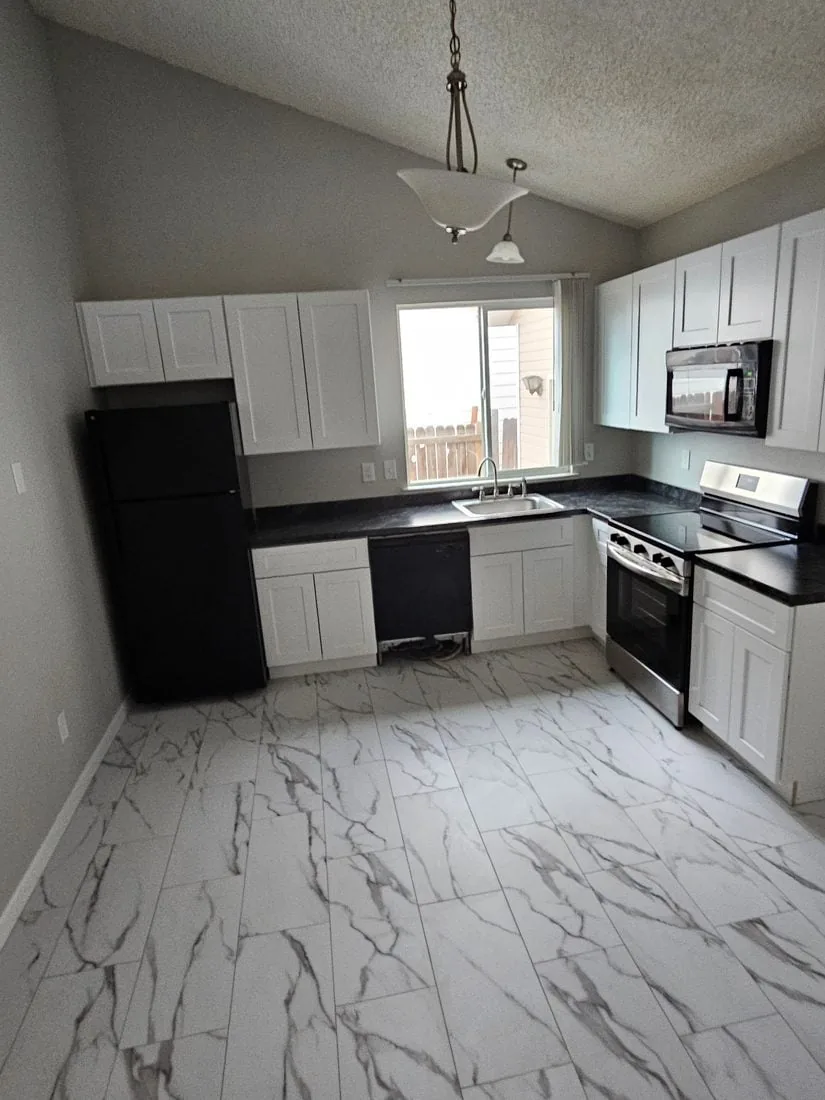 Restored white kitchen after reconstruction by Forefront