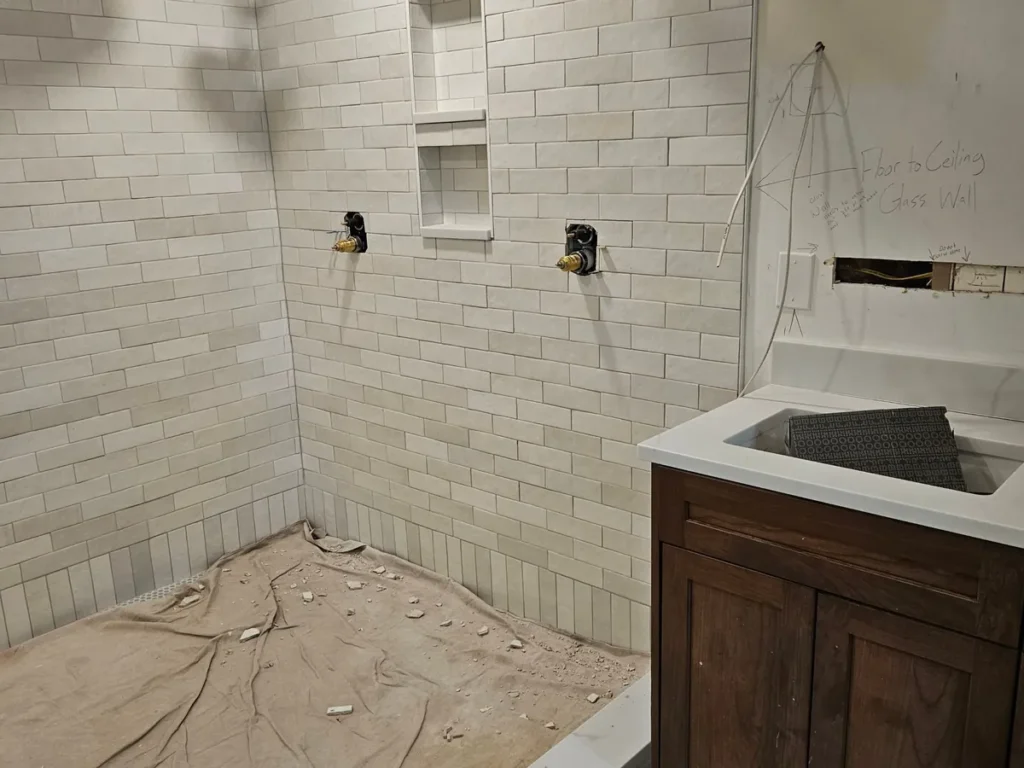 Reconstruction — tiled shower rebuild in progress
