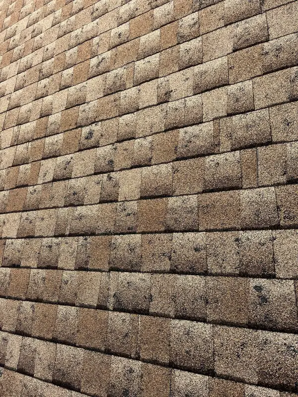 Asphalt shingle roof surface during a Colorado hail damage inspection