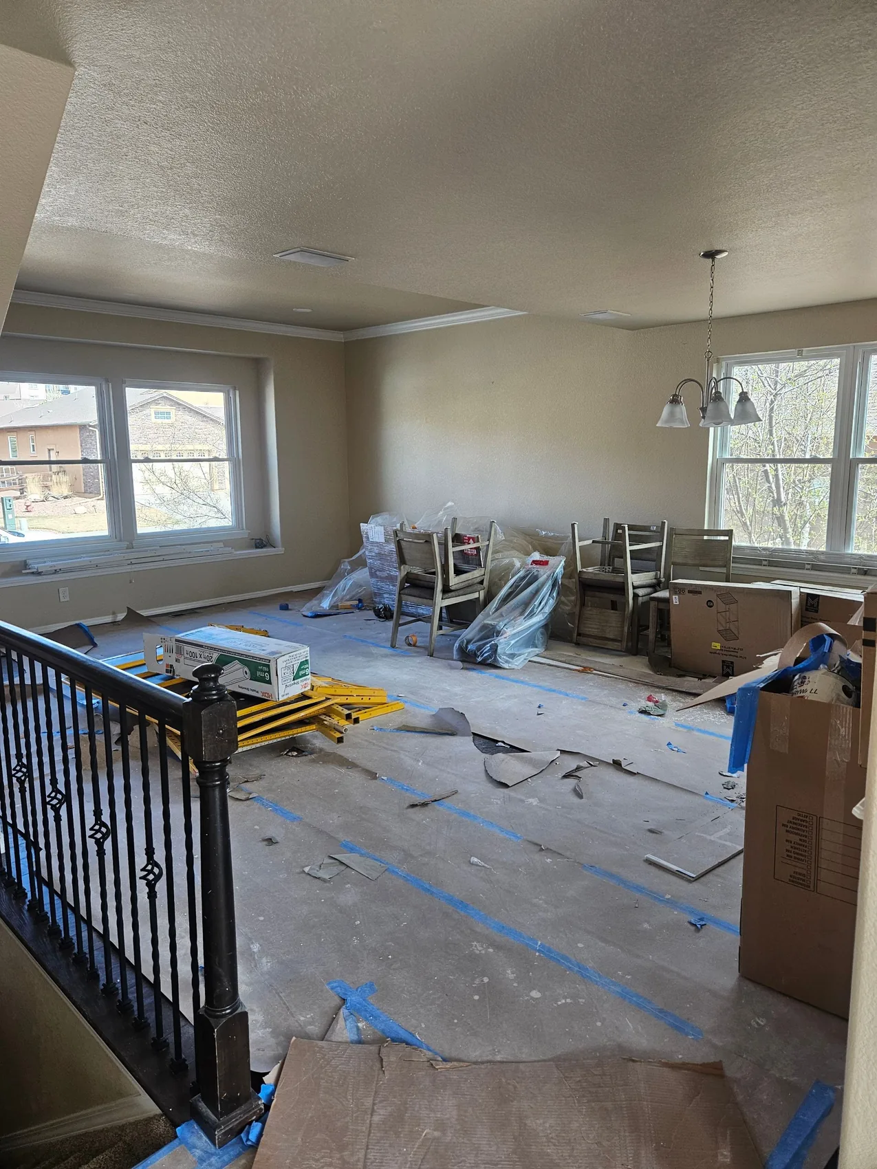 Room masked and prepped for sealing and repainting after smoke damage in Colorado